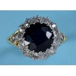 An 18ct, sapphire and diamond cluster ri