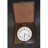 A travel clock, with an 11 cm white enamel Arabic numeral dial, with a Longines movement, 16831,