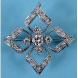 A diamond brooch/pendant, of open quatre