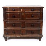 A Continental oak chest, of four long drawers, on turned feet,