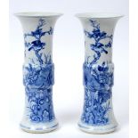 A pair of Chinese blue and white porcelain Gu shaped vases, decorated birds, flowers and foliage,