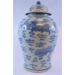 A Chinese blue and white vase and cover, decorated dragons,