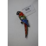 A silver and Swarovski crystal parrot brooch