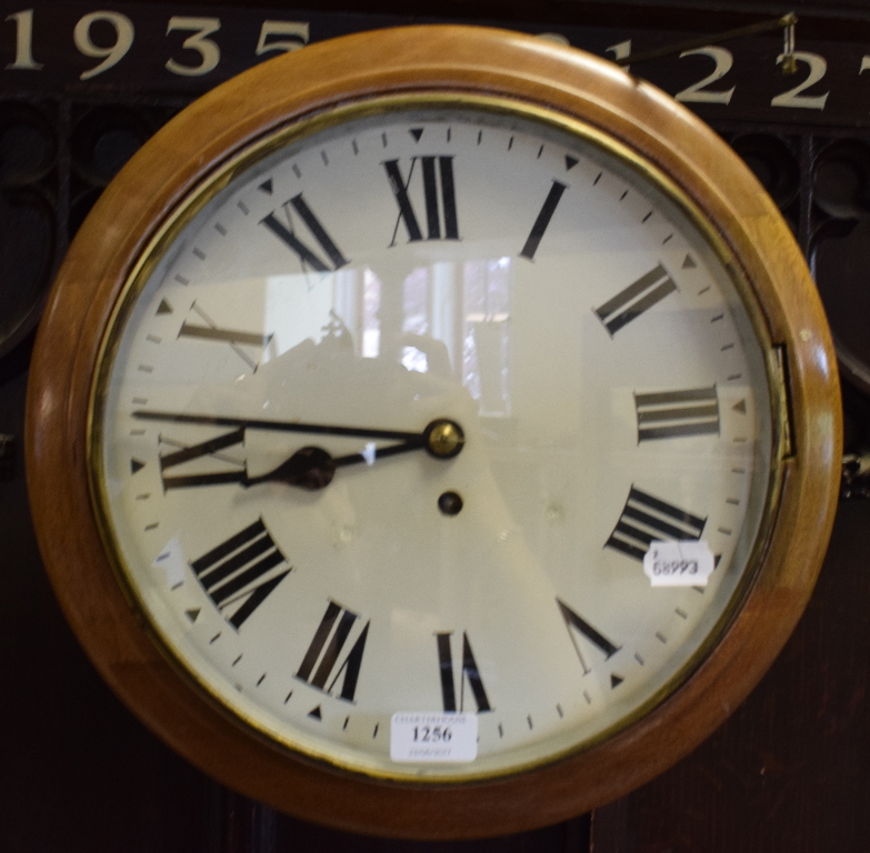 A wall clock, the 29 cm diameter painted dial with Roman numerals,