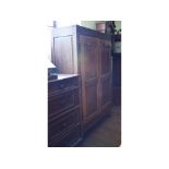 A Continental walnut two door wardrobe, 111 cm wide,