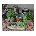 A pair of reconstituted stone garden planters, decorated swags, 39 cm wide, a pottery planter,