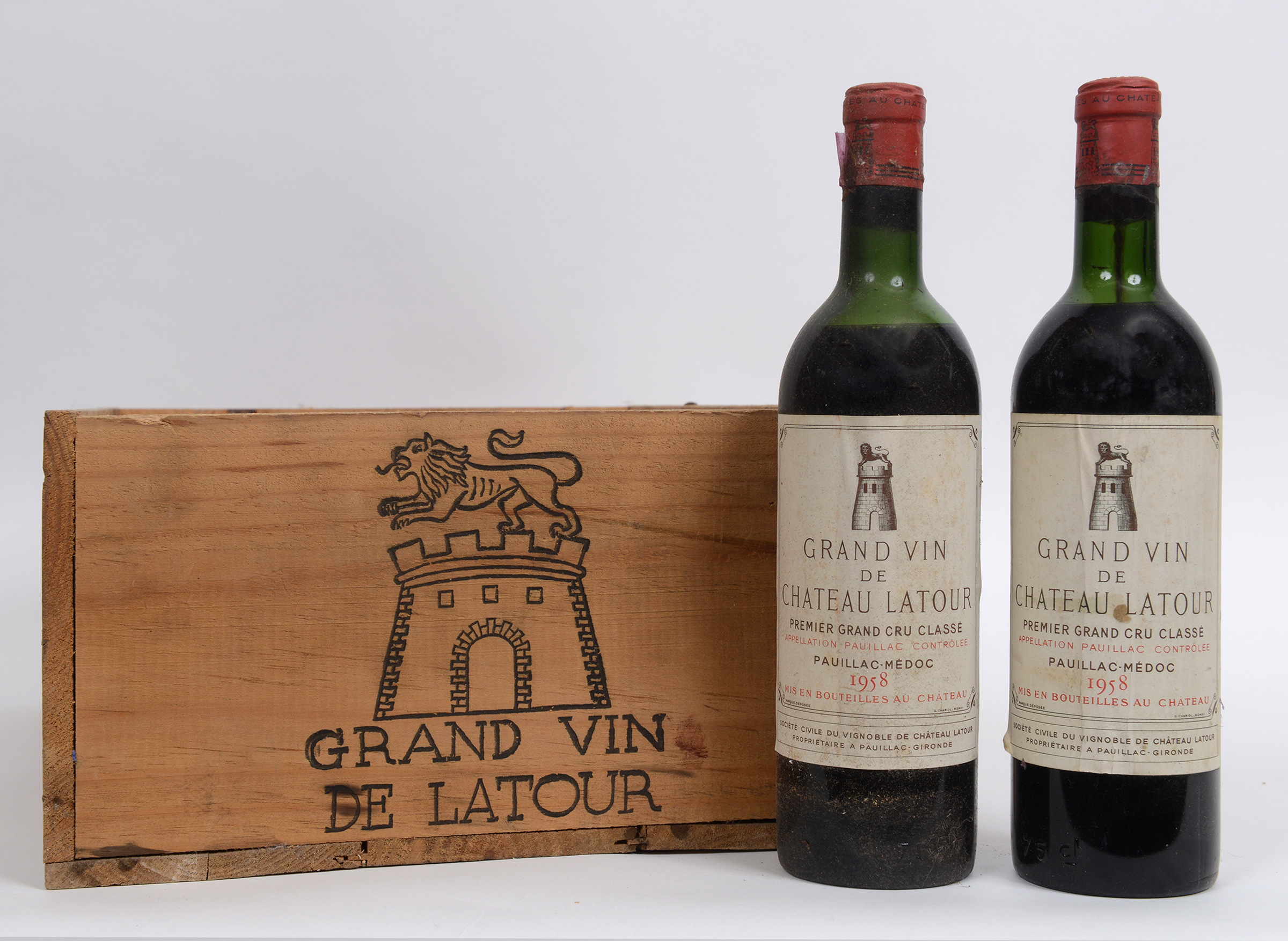 Seven bottles of Chateau Latour Premier Grand Cru Classe, 1958, in a wooden case,