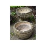 A pair of classical style reconstituted stone garden urns, 55 cm wide,