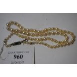 A single strand graduated pearl necklace,