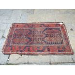 An Eastern flatweave rug, decorated geometric motifs on a red ground, 165 x 98 cm,