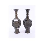 A pair of bronzed vases,
