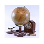 A 20th century table globe (damages), 54 cm high, a bayonet, a set of postal scales,