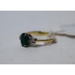 An 18ct gold, emerald and diamond three stone ring, approx.