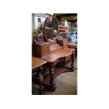 A Victorian walnut Duchess dressing table,