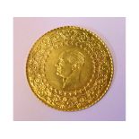 EXTRA LOT: A Turkish 250 Piastres gold coin Condition report Produced 1943-50.