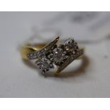 A 9ct gold and three stone diamond ring