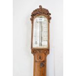A Victorian stick barometer, the ivory register signed T Newman, 122 Regent Strt London,