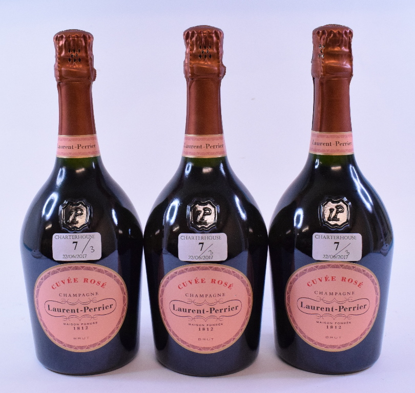 Three bottles of Laurent Perrier Cuvee Rose Champagne,