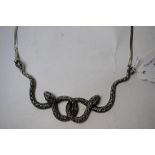 A silver and marcasite snake necklace,