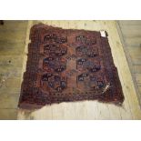 An Afghan rug, decorated geometric motifs on a red ground, within a multi border, 98 x 102 cm,