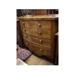 A 19th century mahogany bow front chest, of two short and three long drawers, on turned feet,