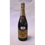 A bottle of Taittinger Champagne,