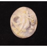 A carved hardstone cameo, decorated two angelic females with flowers and doves,