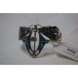 A Art Nouveau style silver and enamel dragonfly bangle
