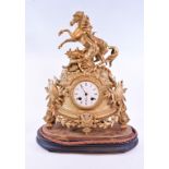 A 19th century French figural mantel clock, 22 cm high with a 7.