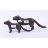 A cast iron nutcracker, in the form of a dog, the handles stamped PATENT NO 273480, 31 cm wide,