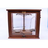 A set of Freddie E Becker & Co of London laboratory balance scales and weights, cased,