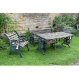 A Victorian style metal and wood garden suite, comprising a table, two chairs, a bench,