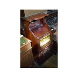 An Edwardian music cabinet, 47 cm wide, and six 19th century balloon back dining chairs,