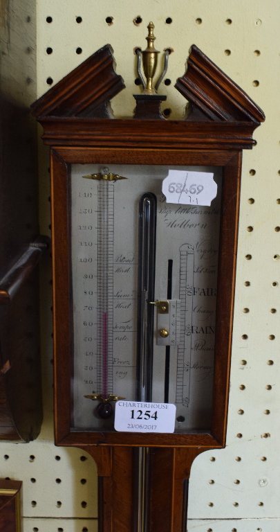 A George III style inlaid mahogany stick barometer, with a silvered dial,