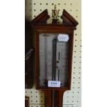 A George III style inlaid mahogany stick barometer, with a silvered dial,