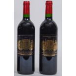 A bottle of Chateau Palmer Margaux, 2001, and another,