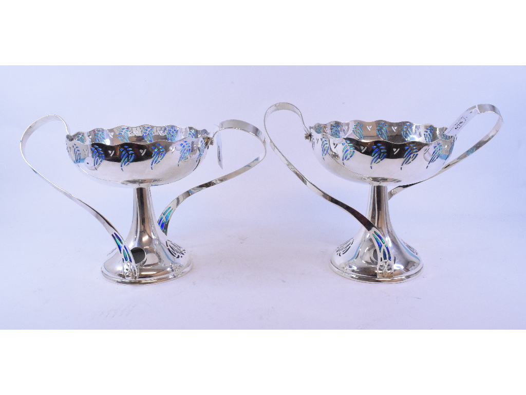 A pair of WMF electroplated two handled tazzas, with pierced and enamel decoration,
