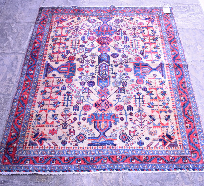 A Persian Afshar Rug, with motifs on a cream ground within a multi border,