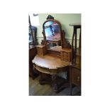 A Victorian mahogany Duchess dressing table, on carved front legs,