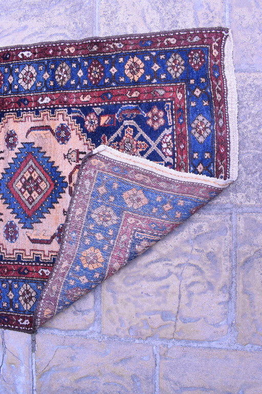 A Persian Nahavand runner, with motifs on a blue ground within a multi border, - Bild 2 aus 3