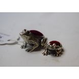 A silver frog pin-cushion,