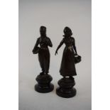 A pair of bronzed Dutch figures, on marble bases, the largest 20.