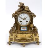 A French mantel clock, the white enamel dial with Arabic numerals and painted roses,