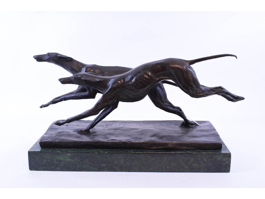 An Art Deco style bronzed group, of greyhounds, on a marble plinth,