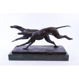 An Art Deco style bronzed group, of greyhounds, on a marble plinth,