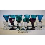 A pair of Regency peacock blue wine glasses, with conical bowls over knopped stems and plain feet,