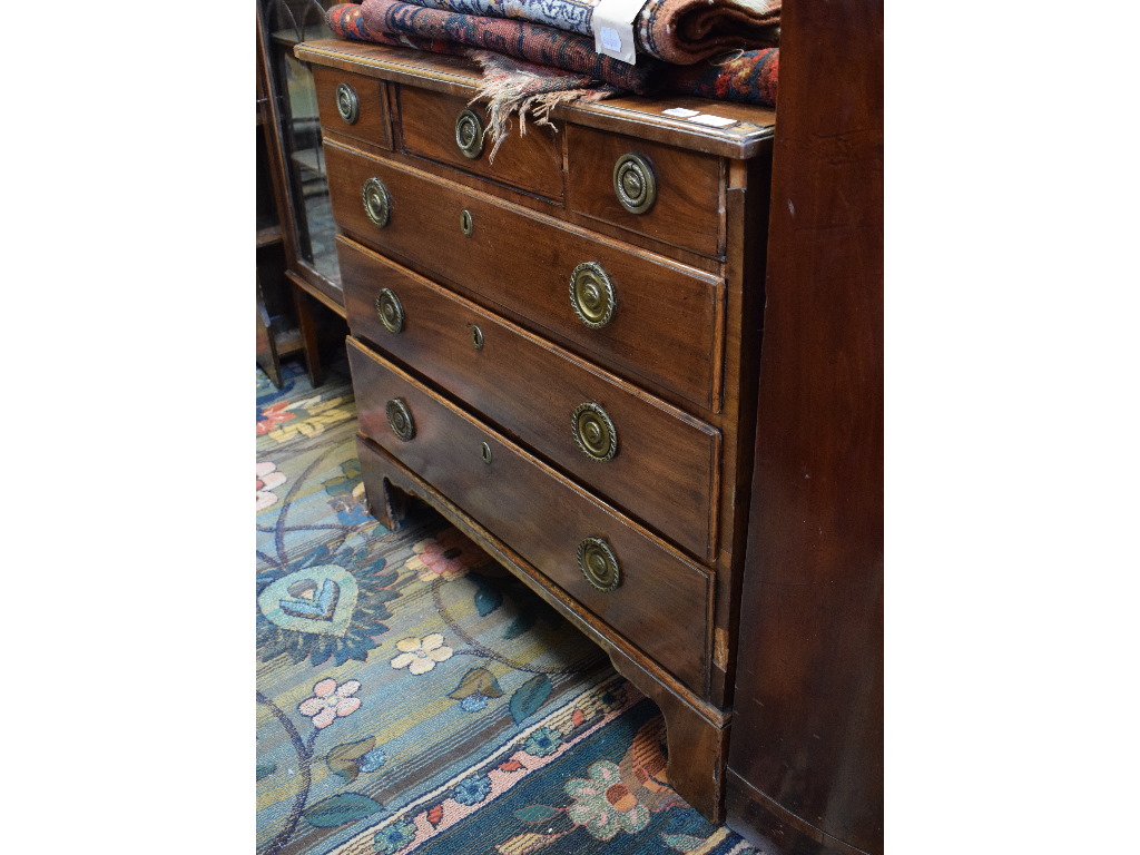 A mahogany bachelor's style chest, of three short and three long drawers, on bracket feet,