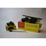 A Dinky Supertoys Honest John missile launcher, 665 and a Dinky Toys field artillery tractor, 688,