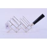 A Dr Christopher Dresser style metal toast rack,