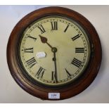 A walnut clock, the 24 cm diameter painted dial with Roman numerals, in a stained beech case,